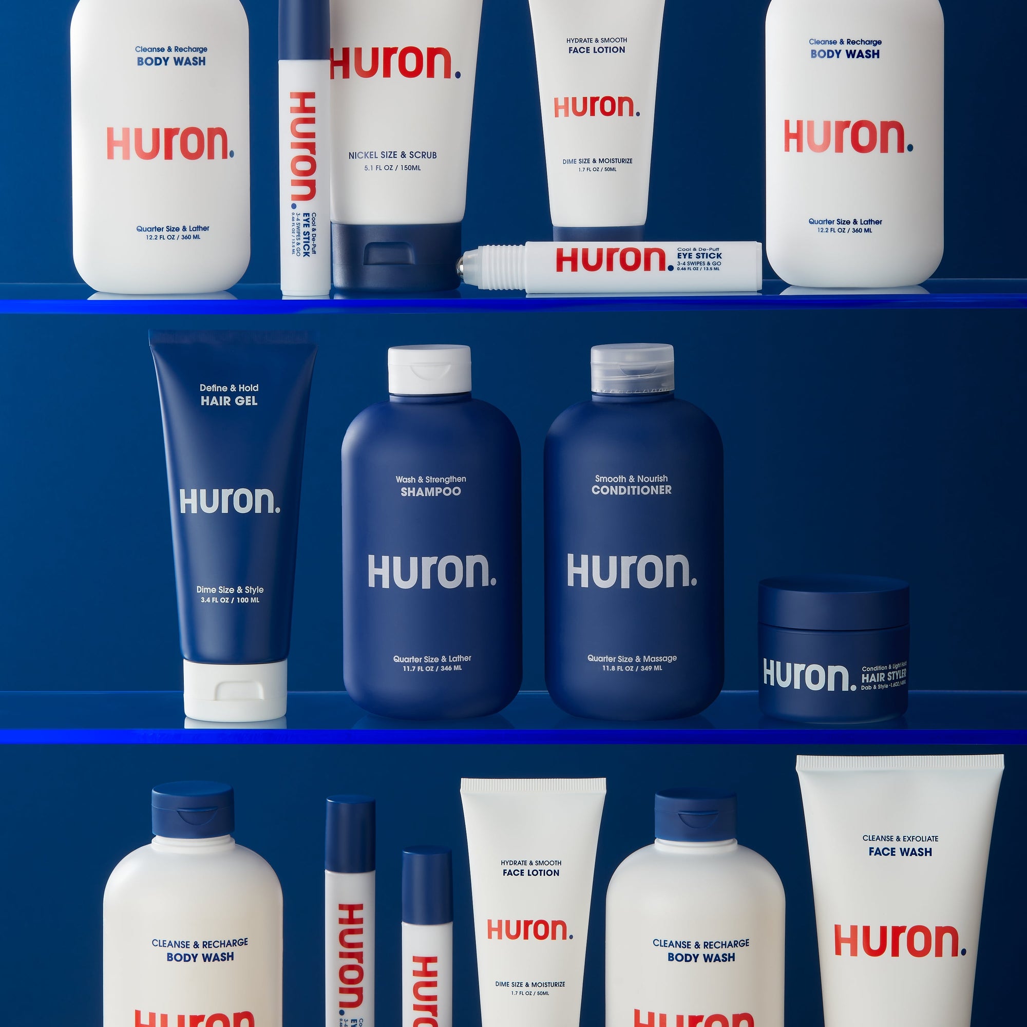 A display of Huron skincare products including body wash, shampoo, conditioner, and face lotion.