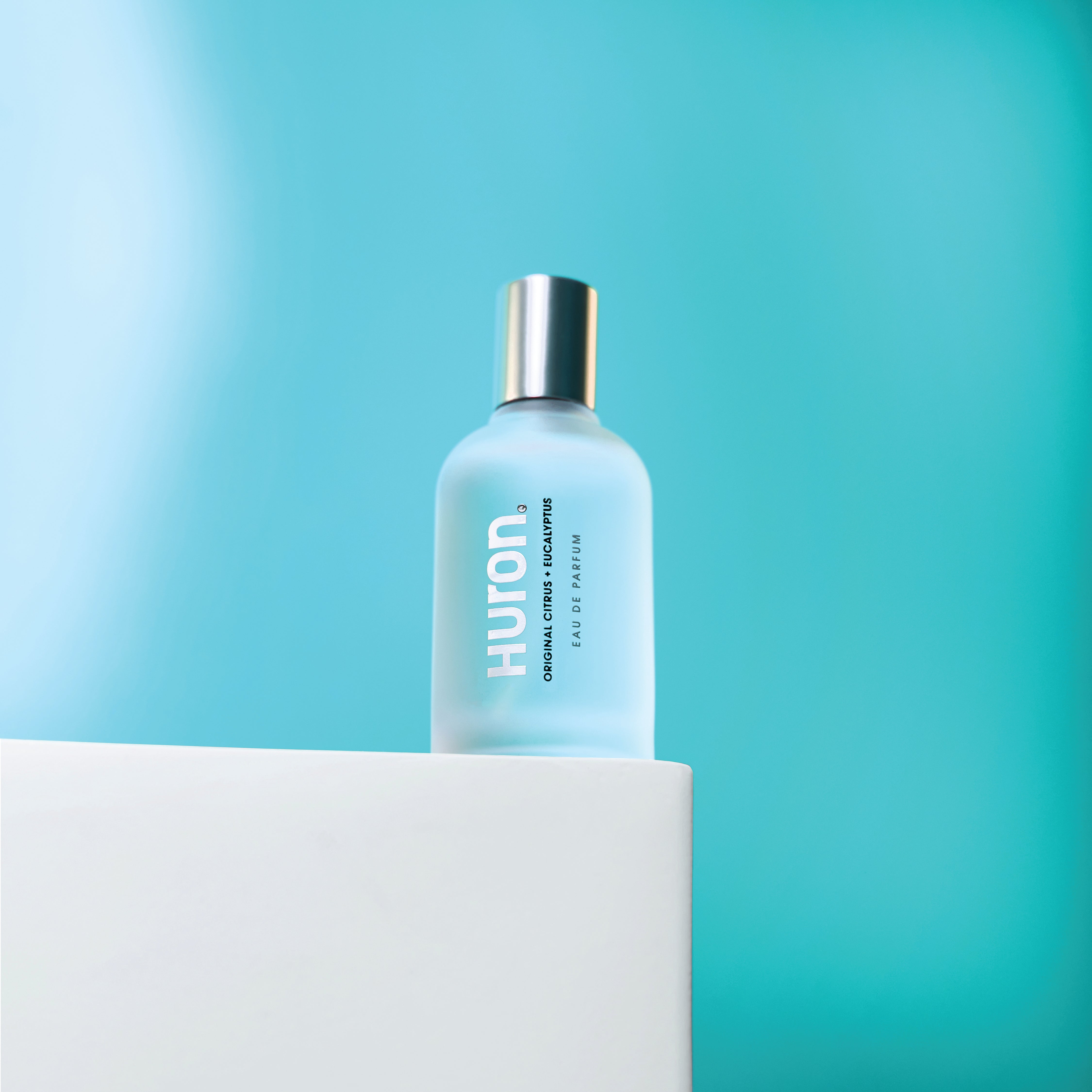 HURON bottle labeled ORIGINAL CITRUS + EUCALYPTUS, EAU DE PARFUM on frosted blue bottle
#scent_citrus + eucalyptus