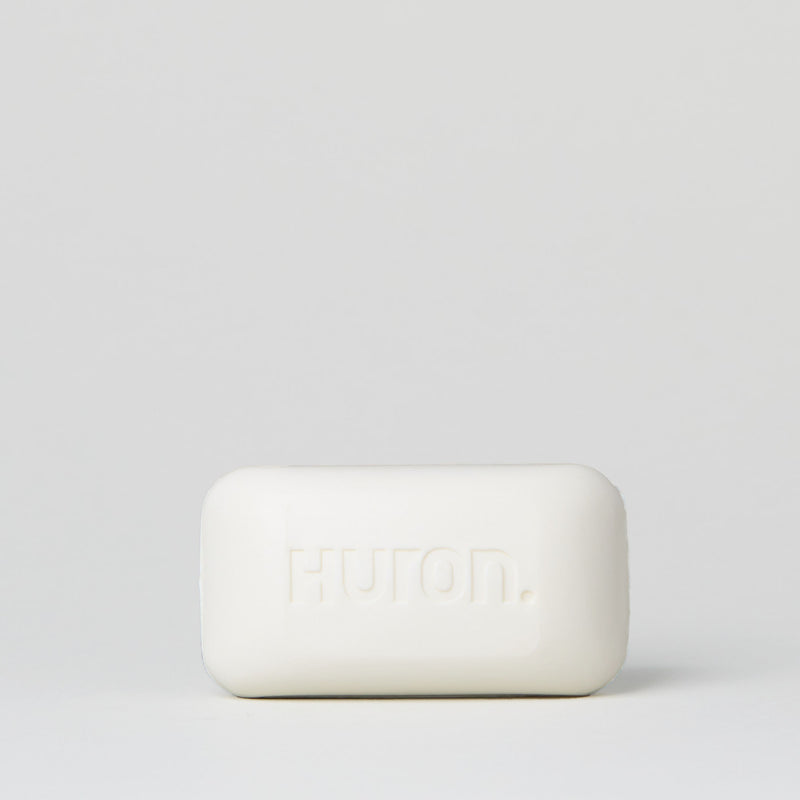 White bar of soap embossed with the word 'buron' on a light gray background