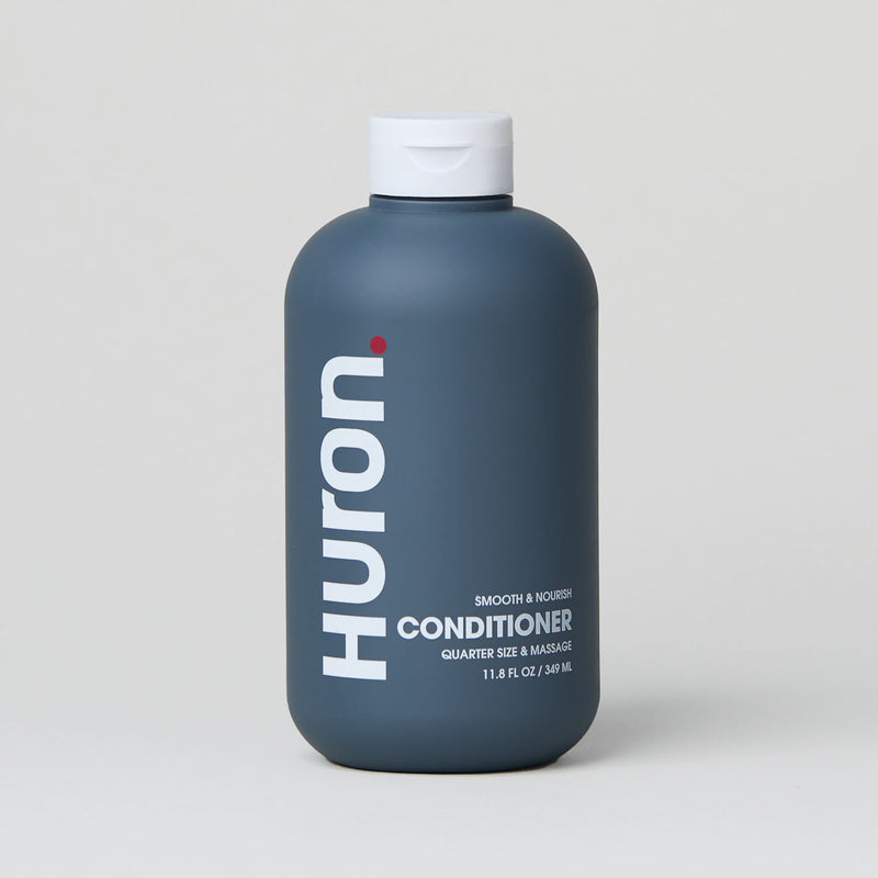 Bottle of Huron conditioner with text: "Huron. CONDITIONER"