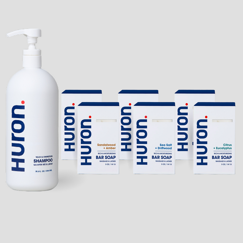 Huron shampoo pump bottle with six Huron bar soap boxes (Sandalwood + Amber; Sea Salt + Driftwood; Citrus + Eucalyptus)
