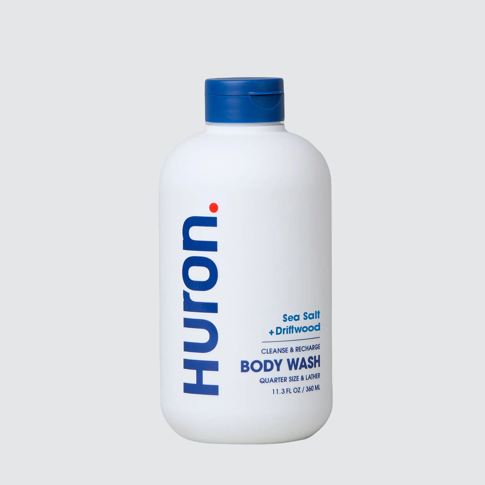 White HURON bottle labeled Sea Salt + Driftwood BODY WASH 11.8 FL OZ