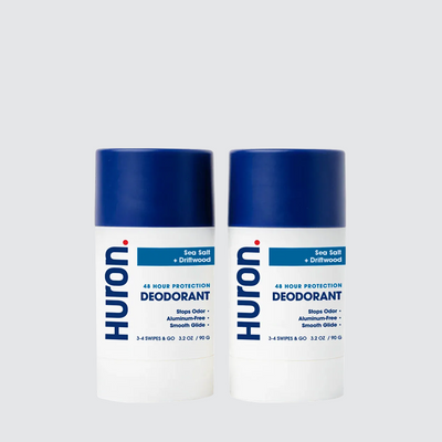 Two Huron deodorant sticks with blue caps, Sea Salt + Driftwood scent #scent_sea salt + driftwood