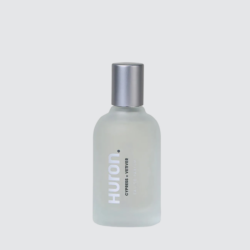 Frosted glass bottle of Huron cologne with text 'CYPRESS + VETIVER EAU DE PARFUM' and silver cap #scent_cypress + vetiver