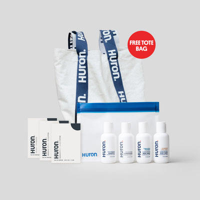 Huron Deluxe Sample Kit including a free tote bag, five bottles, and sample packets.