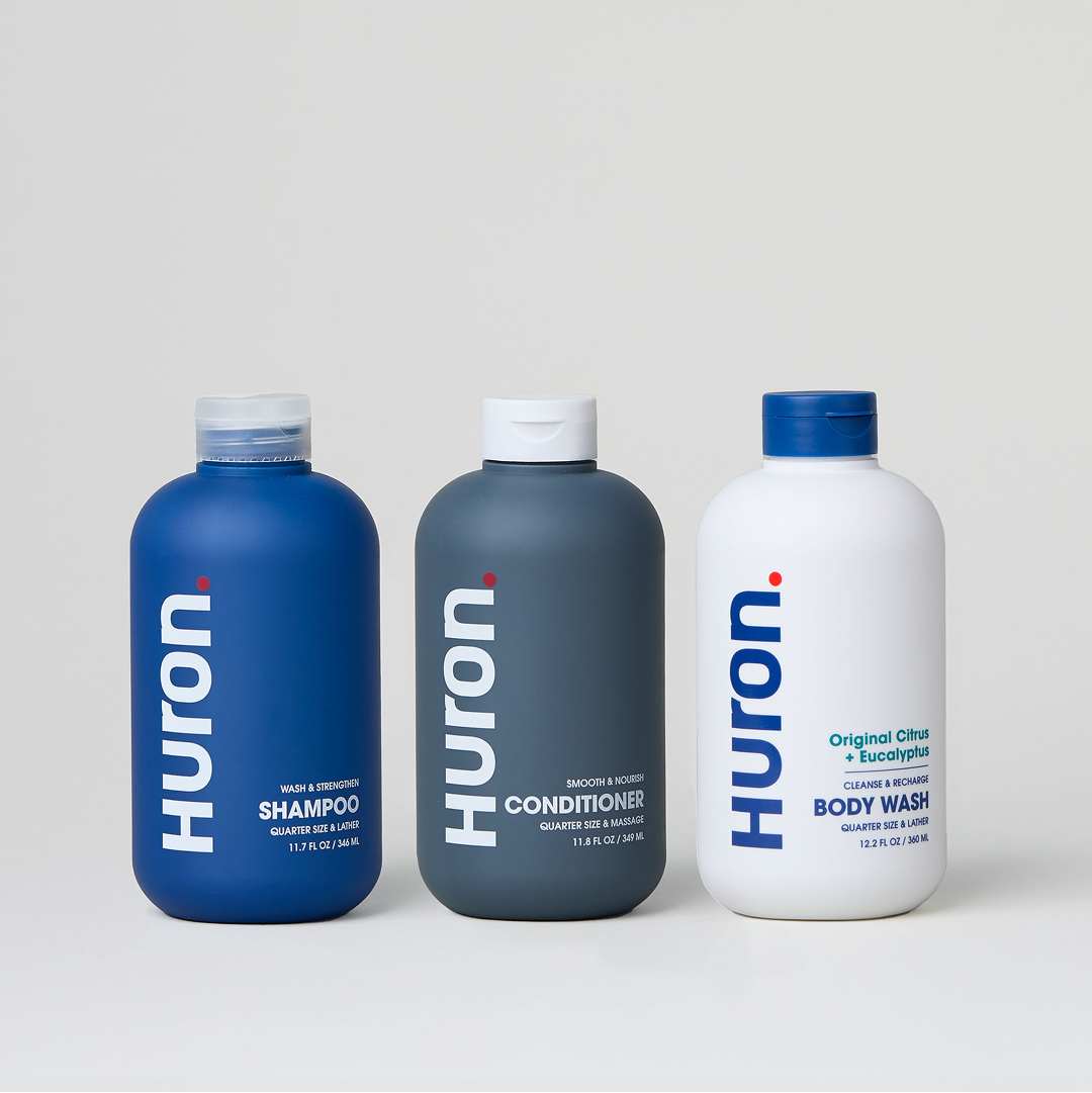 Three Huron products: Shampoo, Conditioner, and Original Citrus Body Wash.