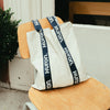 Huron Tote Bag with blue straps on a chair