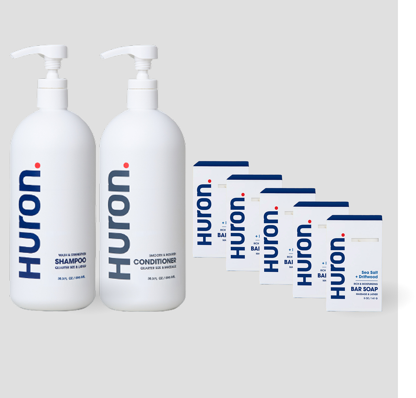 Two white Huron pump bottles labeled Shampoo, Conditioner, and 5 white cartons labeled Huron Bar Soap — Sea Salt + Driftwood scent.