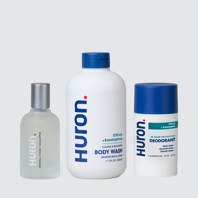 Three huron. products: cologne bottle, Citrus + Eucalyptus BODY WASH, and Citrus + Eucalyptus DEODORANT. #scent_citrus + eucalyptus