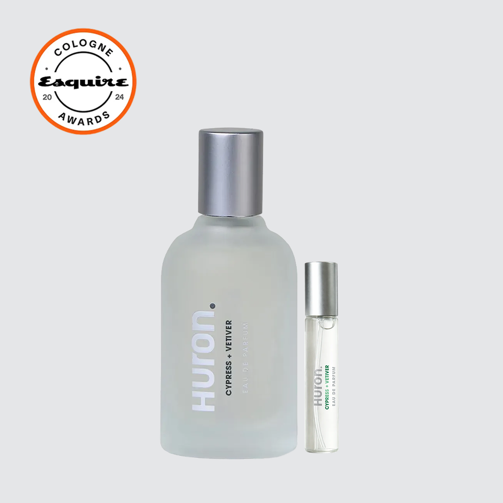Huron frosted bottle and roller vial labeled Huron CYPRESS + VETIVER, with Esquire COLOGNE AWARDS 20 24 badge