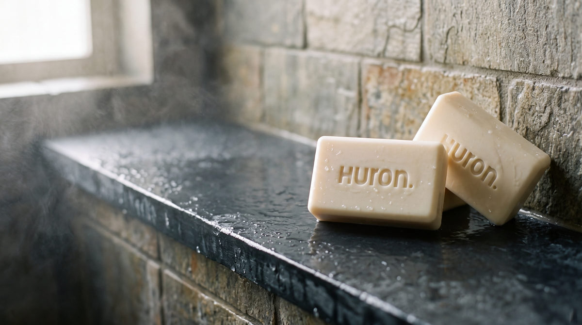 Two Huron bars on a slate shower ledge