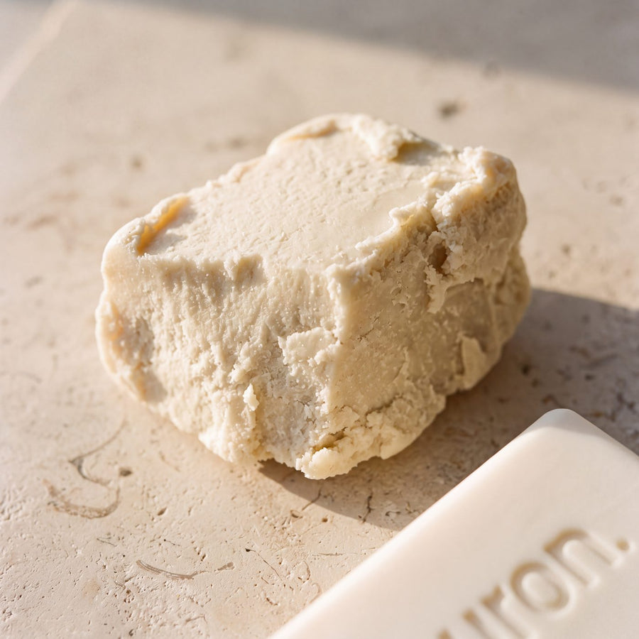 Raw shea butter beside a Huron bar